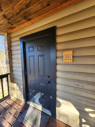 a black door on the side of a house at Lodge At Tellico in Tellico Plains