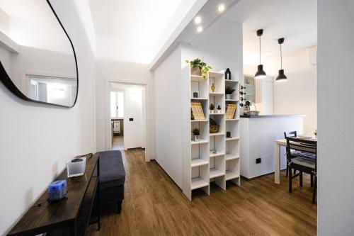 a living room with a table and a dining room at Attico Giglio - Private Terrace near Florence in Scandicci