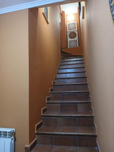 a staircase in a building with brown tiles at Villabalter in Villabalter