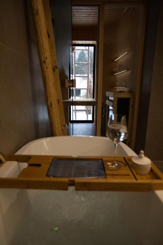 a bath tub in a bathroom with a mirror at Rycerki Dom na Szlaku in Rajcza