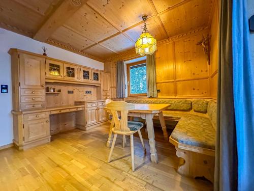 a kitchen with a table and a dining room at Luna Studios Zillertal in Hippach