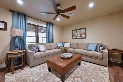 a living room with a couch and a table at Gateway Gathering - House in Luckenbach