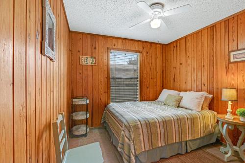 a bedroom with a bed and a ceiling fan at River Haven in Fourth Crossing