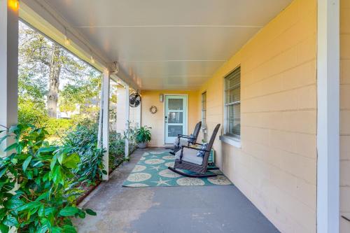 a porch with a rocking chair on the side of a house at Less Than 1 Mi to Beach Family-Friendly Port St Joe Home in Port Saint Joe