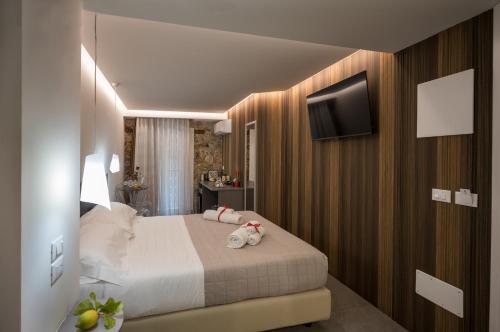 Voodi või voodid majutusasutuse Taormina charming rooms toas