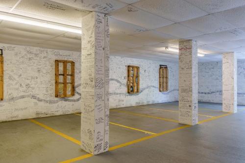 an empty room with white columns and windows at Lodge At Tellico in Tellico Plains