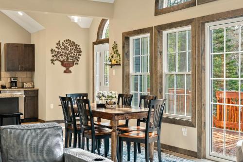 a dining room with a table and chairs at Lakeview Sunset Heaven Waterfront Escape Private Dock Firepit Game Room New Construction in Blakeslee
