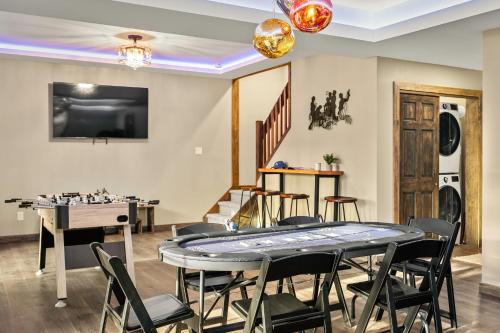 a dining room with a table and chairs at Lakeview Sunset Heaven Waterfront Escape Private Dock Firepit Game Room New Construction in Blakeslee
