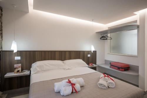 Postel nebo postele na pokoji v ubytování Taormina charming rooms