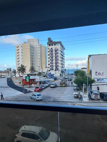 a city with cars parked in a parking lot at Reserva Madero 201 Vista Mar in Natal