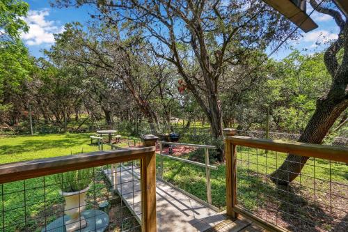 a balcony with a view of a park at Miss Lilian's House in Wimberley