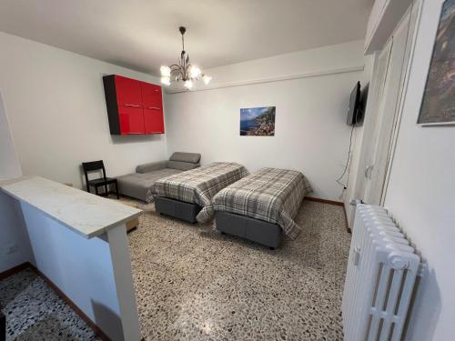 a living room with two beds and a couch at Macloud pub B&B in Sarnico