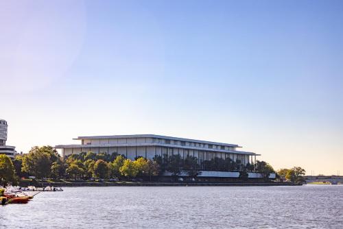 a large building next to a large body of water at Melrose Georgetown Hotel in Washington