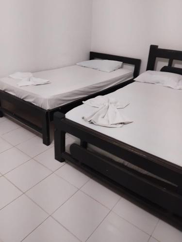 Ένα ή περισσότερα κρεβάτια σε δωμάτιο στο Apartamentos Coveñas TII