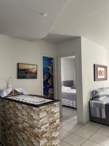 En eller flere senge i et værelse på Residencial Green Diamond