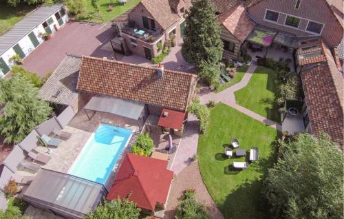 an overhead view of a house with a swimming pool at Pet Friendly Home In Blessy in Blessy
