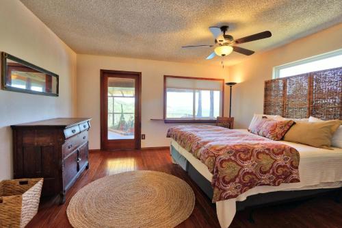 a bedroom with a bed and a ceiling fan at La Vista in Canyon Lake
