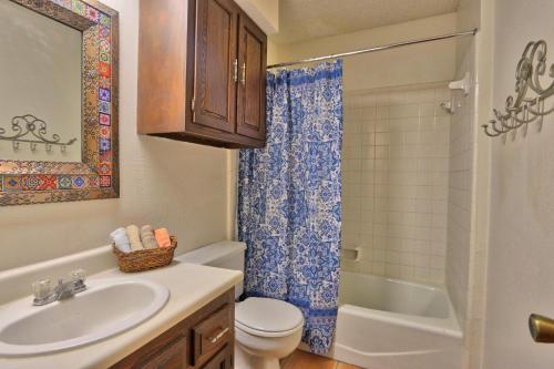 a bathroom with a sink and a toilet and a shower at La Vista in Canyon Lake