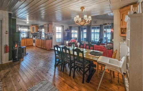 a kitchen and dining room with a table and chairs at Amazing Home In Spydeberg With Wifi in Spydeberg