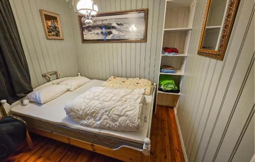 a small bed in a room with a shelf at Amazing Home In Spydeberg With Wifi in Spydeberg