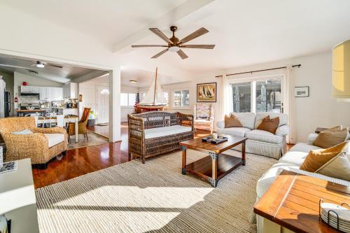 a living room with a couch and a table at Canal-Front Home with Dock in Little Egg Harbor! in Little Egg Harbor Township