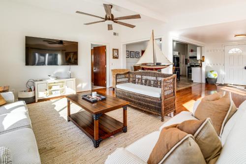 a living room with a couch and a table at Canal-Front Home with Dock in Little Egg Harbor! in Little Egg Harbor Township