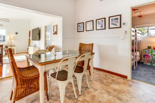 a dining room with a table and chairs at Canal-Front Home with Dock in Little Egg Harbor! in Little Egg Harbor Township