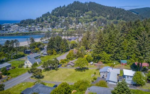 an aerial view of a neighborhood with houses and trees at The Boat House in Yachats