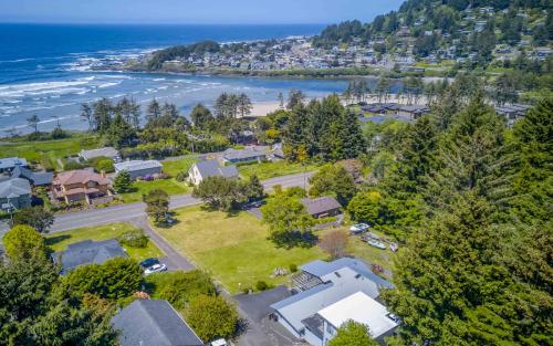 an aerial view of a house with the beach at The Boat House in Yachats