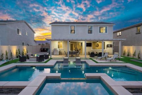 a large swimming pool in front of a house at Desert Encanto in Coachella
