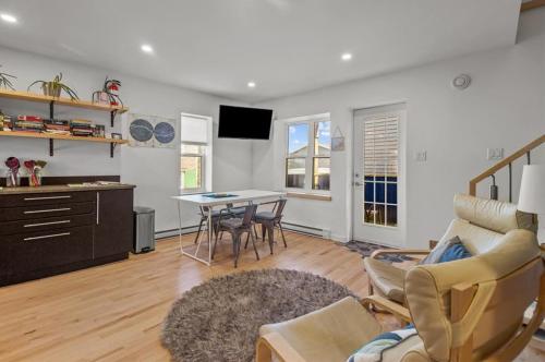 a living room with a couch and a table at The Cabot 2bds 2ba Patio in St. John's