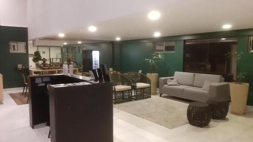 a living room with a couch and a table at Reserva Madero 201 Vista Mar in Natal