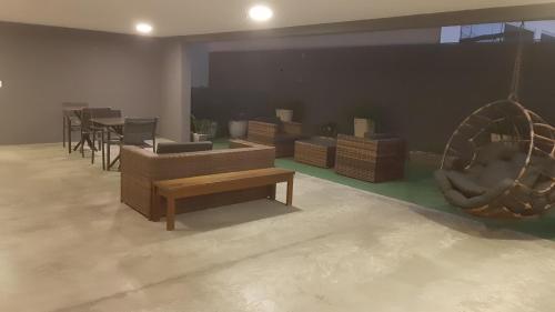 a living room with couches and chairs and a table at Reserva Madero 201 Vista Mar in Natal