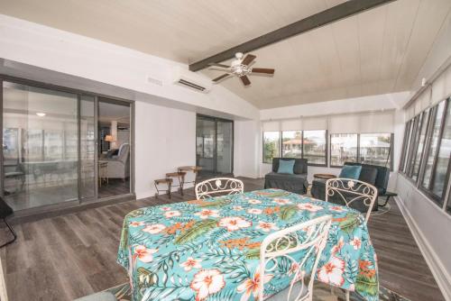 a bedroom with a bed and a living room at Laughing Gull House in Crawfordville