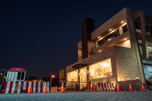 a building with orange and white cones in front of it at Best Western Faisalabad in Faisalabad