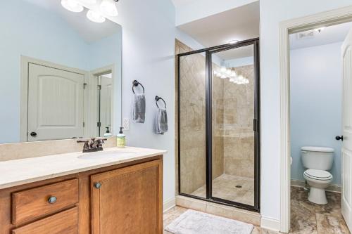 a bathroom with a shower and a sink and a toilet at Private Patio, Decks Waterfront Eatonton Townhome in Eatonton 