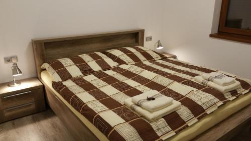 A bed or beds in a room at Chalupa na Lipně - Holiday House 1
