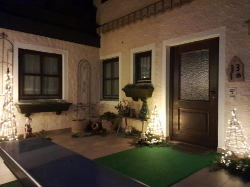 a room with a door and a green carpet at Ferienhaus Resch in Laufen