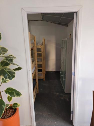 an open door to a room with a closet at Ô de casa hostel in Balneário Camboriú