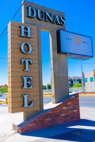 a sign for a dunder mifflin company at Hospedaje Consular by Dunas in Ciudad Juárez