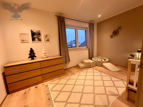 a childs room with a large window and a crib at River Lake Inn - Muldestausee in Pouch