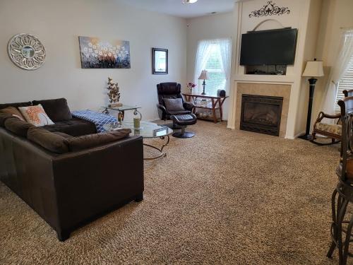 a living room with a couch and a fireplace at Tri-Cities Home Away from Home in Richland