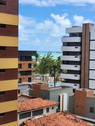 a view of a city with buildings and a beach at Flat Quartz 503 in Cabedelo