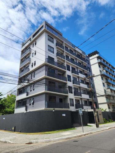 an apartment building on the corner of a street at Flat Quartz 503 in Cabedelo