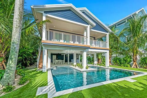 an exterior view of a house with a swimming pool at Totally Beachin' in Bradenton Beach