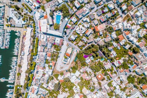 an overhead view of a city with houses and water at Ha La Bodrum in Bodrum City