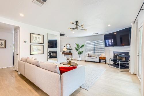 a living room with a couch and a table at Bright & Luxury Entire House in Peaceful Neighborhood in Leander