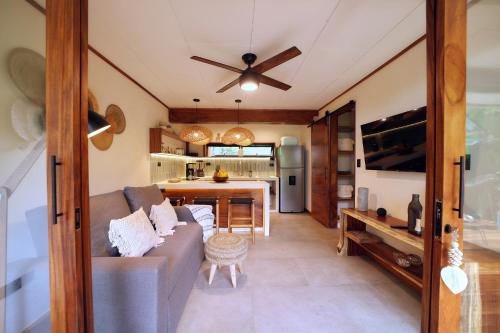 a living room with a couch and a table at Wabi Sabi Hana in Punta Uva