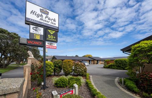 a sign for a hotel parking meter in a driveway at ASURE Highpark Motor Inn in Greymouth