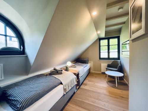 En eller flere senge i et værelse på Ferienhaus Strandleben 09 Feriendorf Klein Stresow Rügen by ruyastay